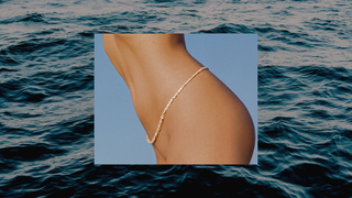 A photo on centered with a photo of the ocean surface, showing a woman's bare torso wearing a pearl belly chain.