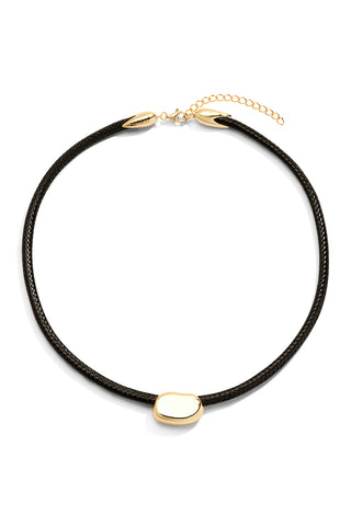 Necklace with black cord and gold clasp and pendant on a white background