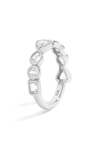 Silver ring with bezel set white sapphires  on a white background