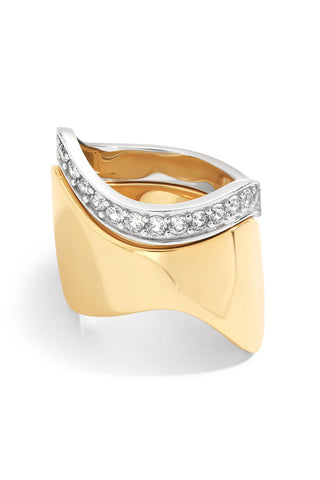 Gold and silver ring set with diamond accents on a white background