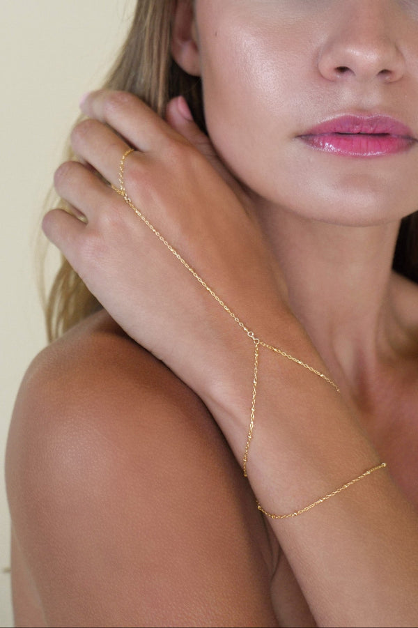 Gold lola double hand chain on model close-up