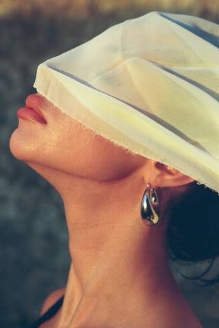 NAiiA Adelaide Hoops _  Rhodium Teardrop Hoop Earrings on model