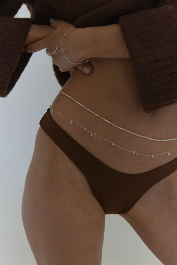 naiia brigitte belly chain in silver on model close up