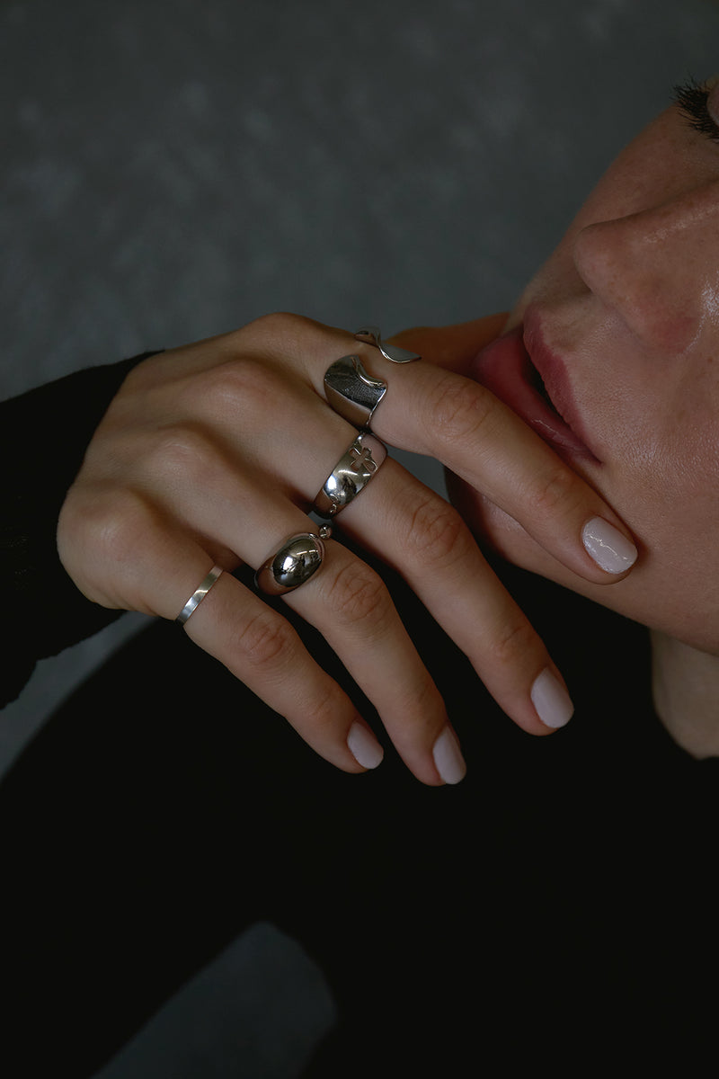 NAiiA silver rings on model close up image