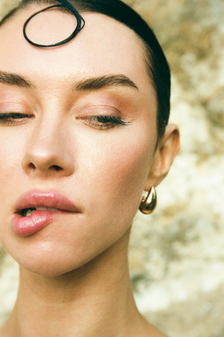 NAiiA Luna Earrings _ 14K Yellow Gold and Rhodium Teardrop Earrings on model