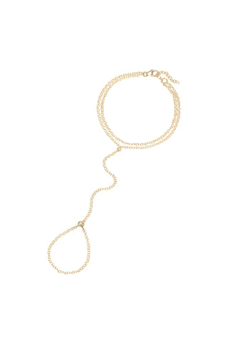 A delicate gold hand chain featuring a double bracelet, displayed on a solid white background.