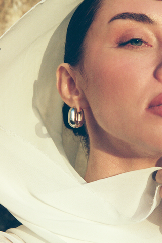 NAiiA Willow Huggies _ 14K Yellow Gold and Rhodium Mixed Metal Huggies on model