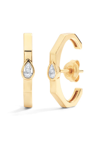 Gold hoop earrings with pear-shaped gemstones on a white background