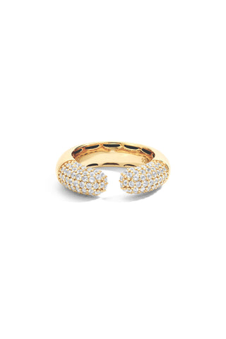 Gold dome ring with a gap at the center with pave set lab grown white sapphires on either side on a white background