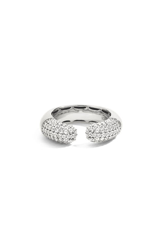 Silver dome ring with a gap at the center with pave set lab grown white sapphires on either side on a white background