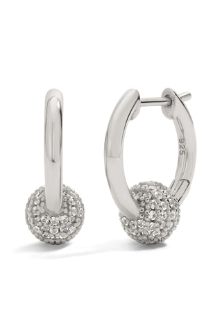 Silver hoop earrings with spherical ends on a white background