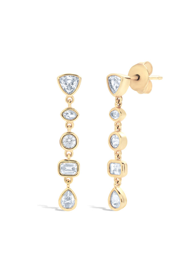 Pair of gold tennis earrings with alternating shaped lab grown sapphires in marquise, pear, round, and baguette shapes on a white background