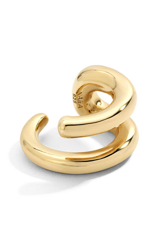 Gold spiral ear cuff on a white background