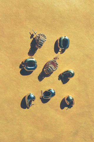 earrings on yellow background