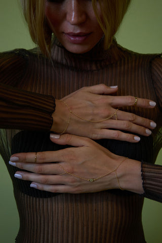  two gold hand chains, blonde model
