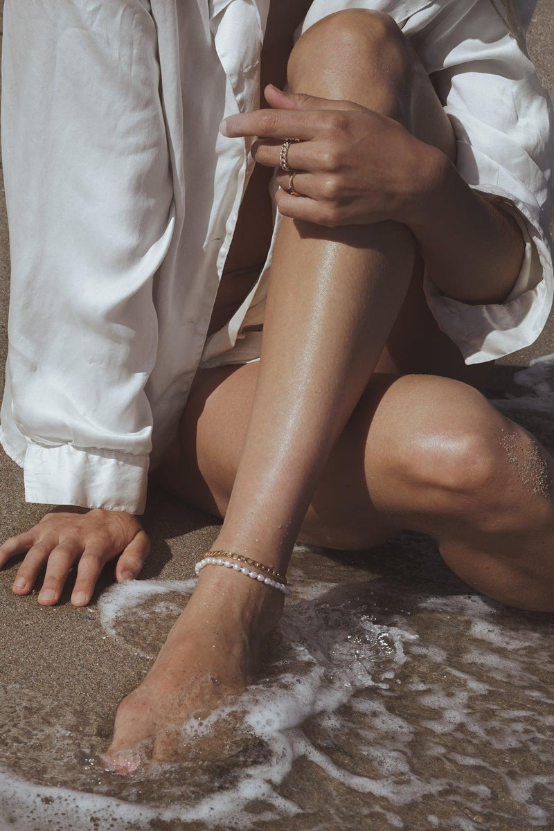 14k gold filled chain and pearl anklets on model