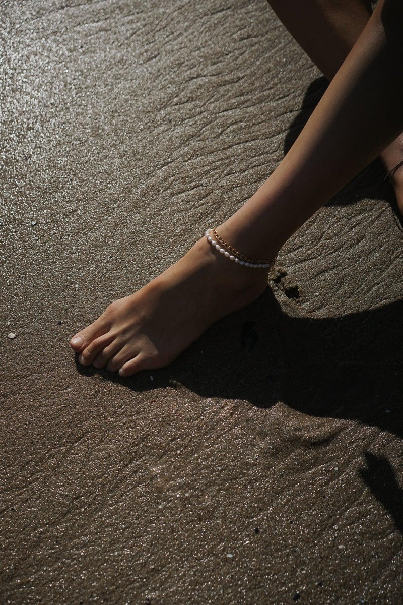 14k gold filled pearl and chain anklets on model