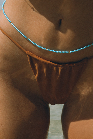 NAiiA Dorsa Belly Chain 14K Yellow Gold Turquoise Belly Chain on model