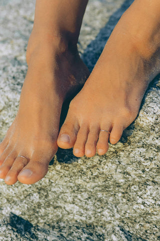 Model with 14k gold filled toe ring